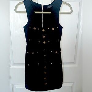 black mini dress with gold buttons